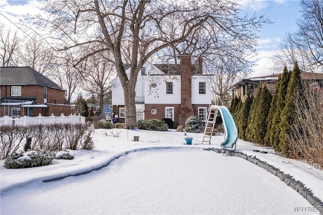 view of snow covered property