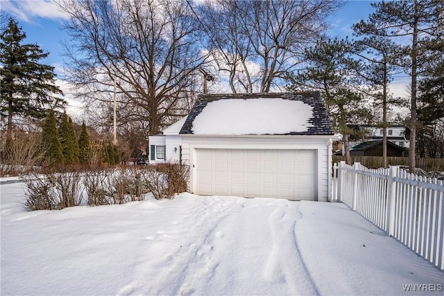 view of snow covered garage