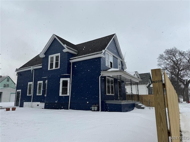 view of snow covered property