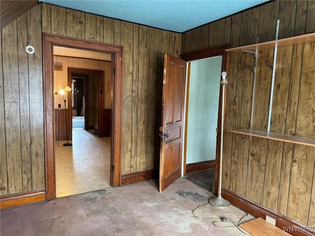 empty room featuring wooden walls