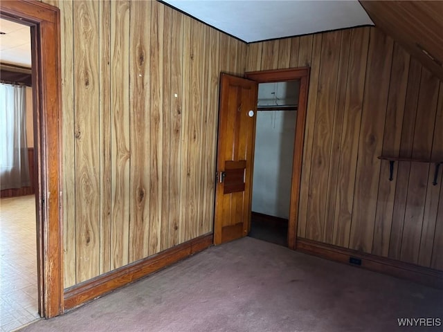 interior space featuring wood walls