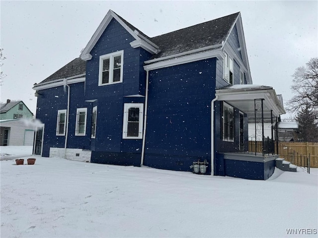 view of snow covered property