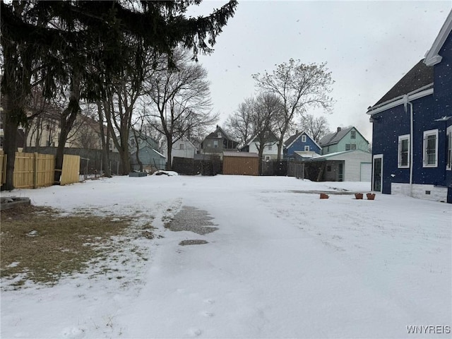 view of yard layered in snow