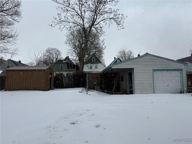 exterior space featuring a storage unit and a garage