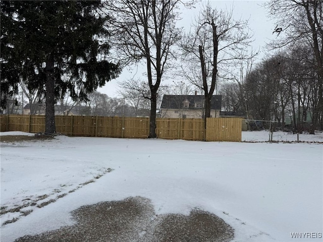 view of yard covered in snow