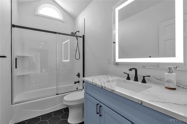 full bathroom with lofted ceiling, enclosed tub / shower combo, vanity, toilet, and tile patterned floors