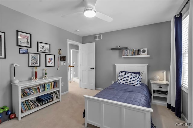 carpeted bedroom with ceiling fan