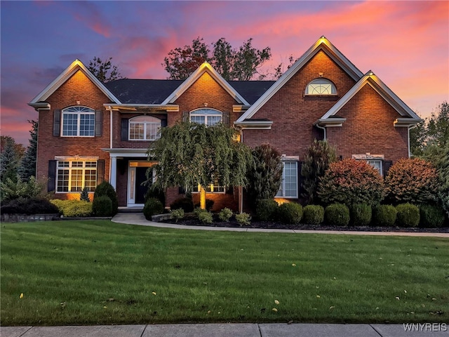 view of front of property with a yard