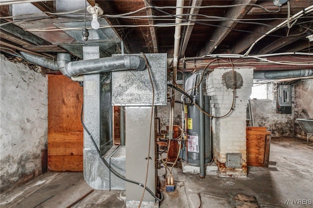 utility room with heating unit, electric panel, and water heater