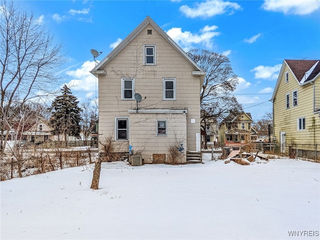 view of snow covered house