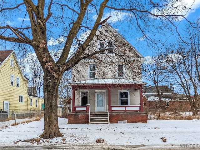 view of front property featuring covered porch