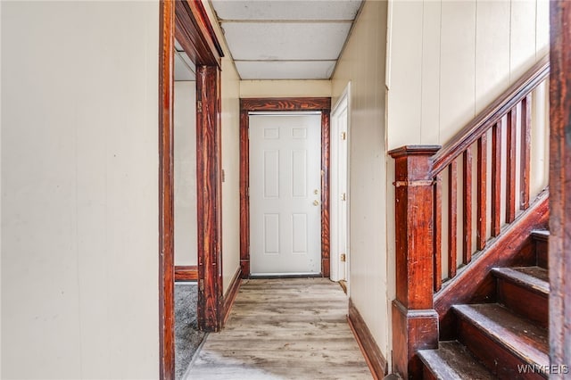 hall with light hardwood / wood-style flooring