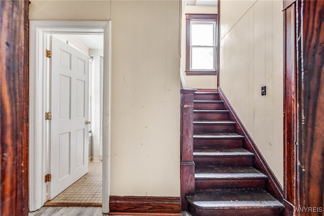 stairway with wooden walls