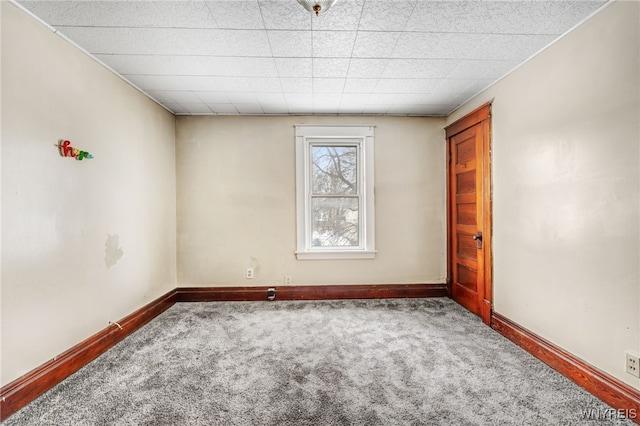 unfurnished room with carpet flooring