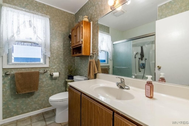 bathroom featuring tile patterned flooring, vanity, a wealth of natural light, and walk in shower