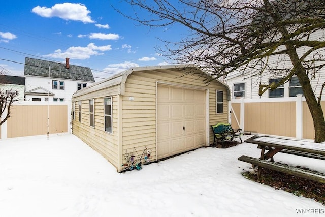 view of snow covered garage