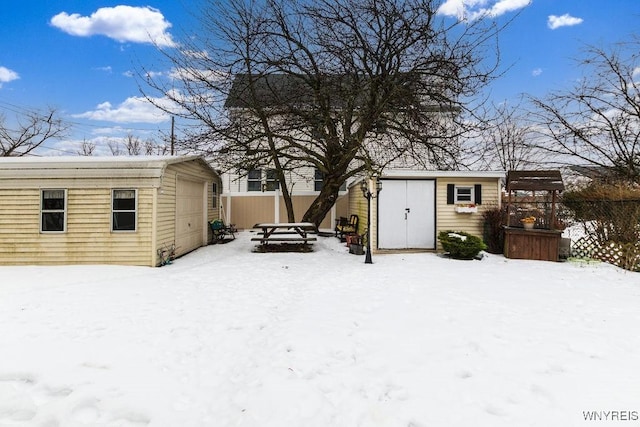 exterior space with a garage and a storage shed