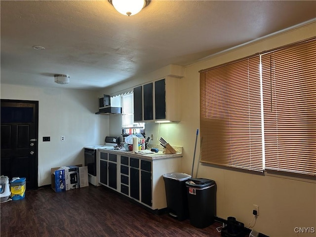 kitchen featuring electric range, dark wood-type flooring, and wall chimney exhaust hood