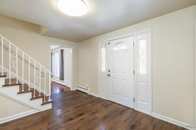 entryway featuring baseboard heating and dark wood-type flooring