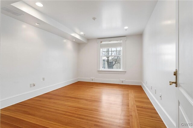 1208 James St, Syracuse, NY 13203 - spare room featuring wood-type flooring