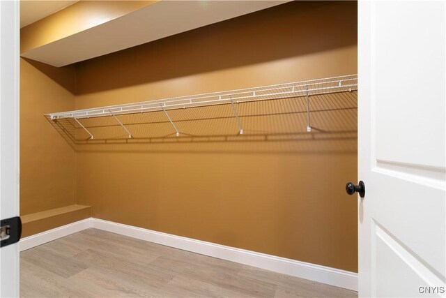 1208 James St, Syracuse, NY 13203 - spacious closet featuring wood-type flooring