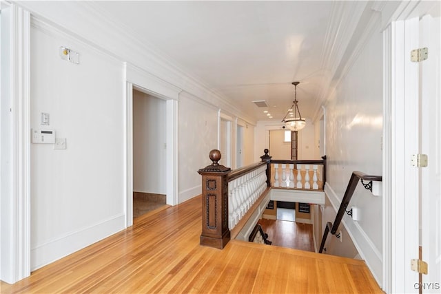 1208 James St, Syracuse, NY 13203 - staircase featuring crown molding and hardwood / wood-style floors