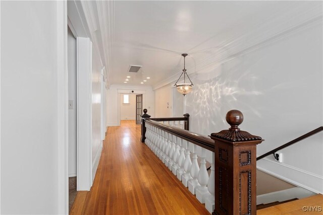 1208 James St, Syracuse, NY 13203 - corridor featuring ornamental molding and light wood-type flooring