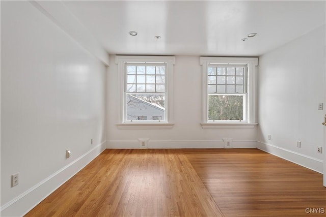 1208 James St, Syracuse, NY 13203 - unfurnished room with plenty of natural light and light hardwood / wood-style flooring