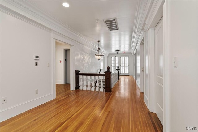 1208 James St, Syracuse, NY 13203 - corridor featuring hardwood / wood-style floors and ornamental molding