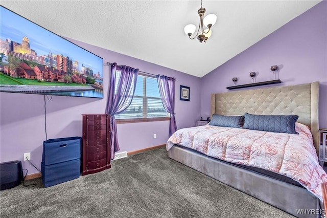 bedroom with carpet floors, vaulted ceiling, and a textured ceiling