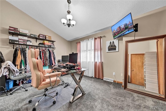 office featuring an inviting chandelier, carpet flooring, vaulted ceiling, and a textured ceiling