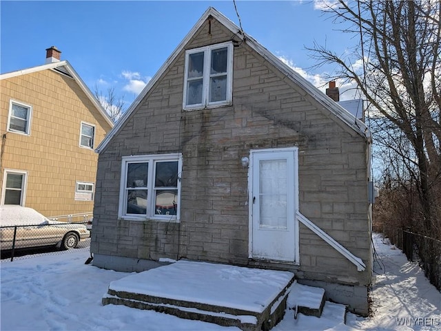 view of snow covered house