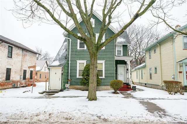 view of snow covered house