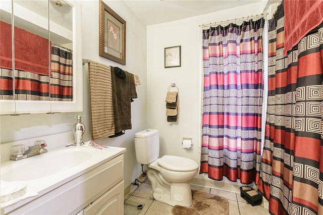 bathroom featuring a shower with curtain, vanity, tile patterned floors, and toilet