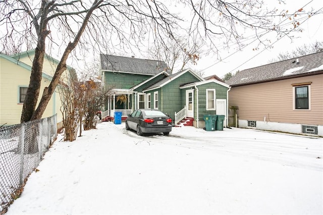 view of snow covered house