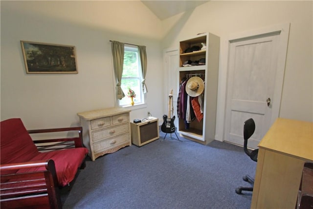 office space with dark colored carpet and vaulted ceiling