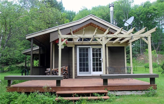 rear view of property featuring a deck