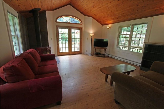 living room with wood ceiling, a baseboard radiator, vaulted ceiling, and light wood-type flooring