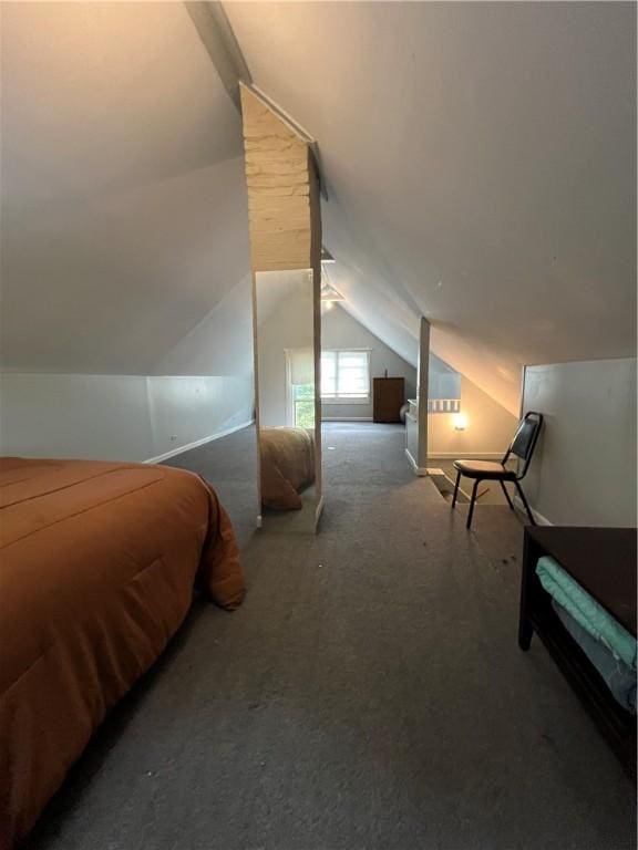 bedroom featuring vaulted ceiling and carpet