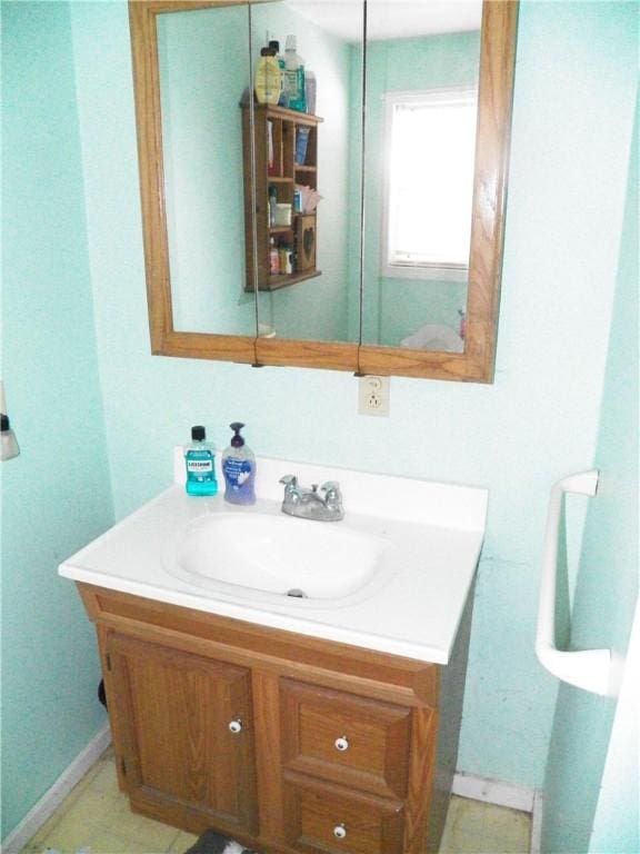 6024 W Willow Pt, Canadice, NY 14471 - bathroom featuring vanity and baseboards