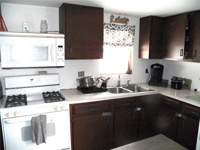 6024 W Willow Pt, Canadice, NY 14471 - kitchen featuring white appliances, a sink, dark brown cabinets, and light countertops