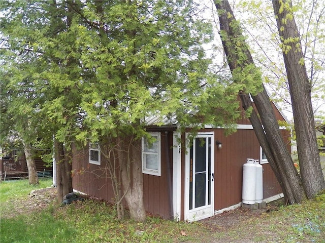 6024 W Willow Pt, Canadice, NY 14471 - view of side of home featuring an outdoor structure and fence
