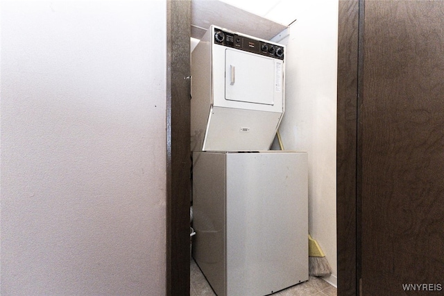 laundry room featuring stacked washer and dryer