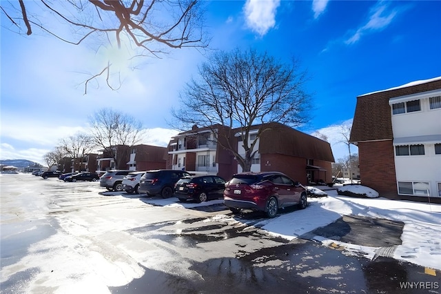 view of snow covered parking