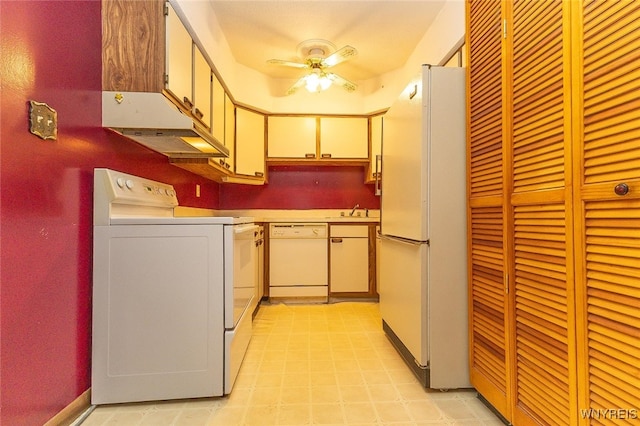 kitchen with ceiling fan, sink, and white appliances