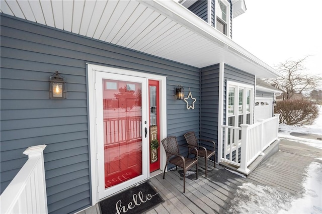 snow covered deck with covered porch