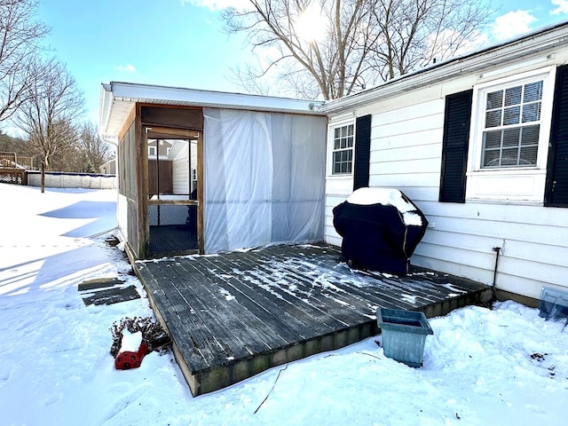 snow covered deck with grilling area