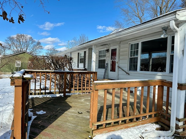 view of snow covered deck