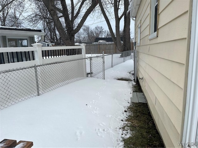 view of yard layered in snow