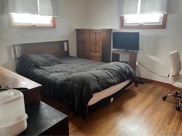 bedroom with wood-type flooring